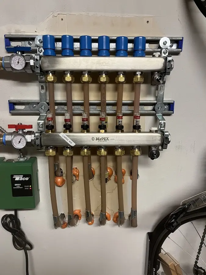 Plumber performing Water Heater Repair at a residential property in Crane